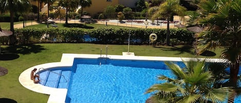 One of the pools with parasols & sunbeds