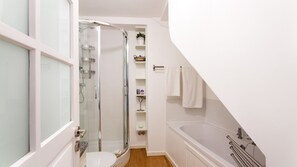 Family bathroom on ground floor with bath tub,  shower, W.C. and handbasin