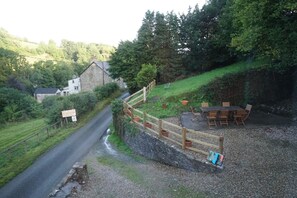 Grassy slope behind upper terrace