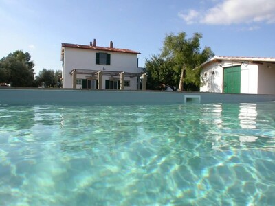 A farm house, situated on a hillock of the Maremma in the Latium