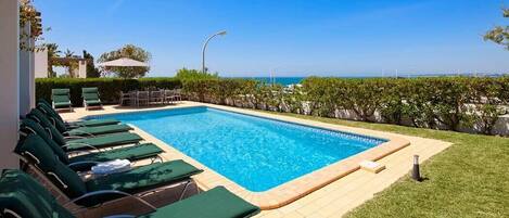 Pool, garden and sea view
