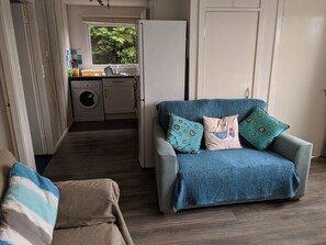 new 2 seater sofa in living/dining room