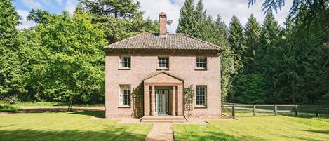 Bear's Cottage, Wood Norton: Front elevation nestled in woodland