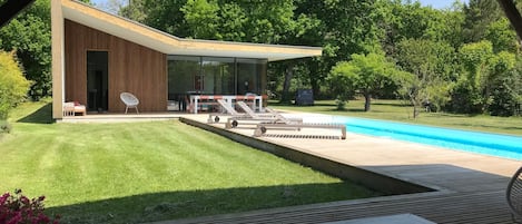 View of house and pool from covered terrase