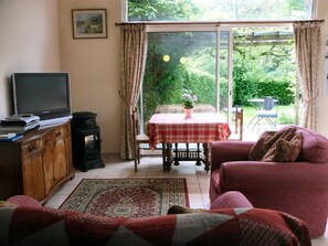 Bright spacious lounge, with patio doors to the garden.
