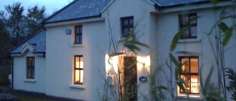 front of cottage overlooking country lane