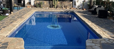 Lovely pool with traditional local stone paving.