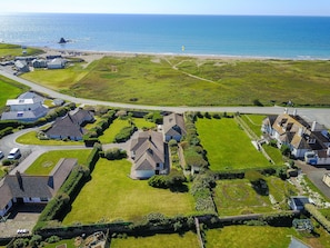 Aerial view of house and beach
