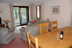 Living room with patio door to front terrace