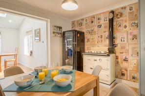 Ground floor:  Kitchen with large Smeg fridge/freezer and decorative Rayburn