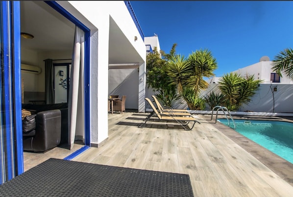 Relaxing by the garden pool