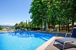 The pool area with plenty of sunbeds