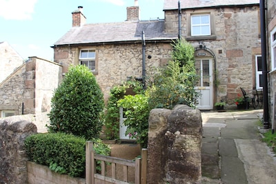 Nestled within a  perfect village setting of the Peak District National Park