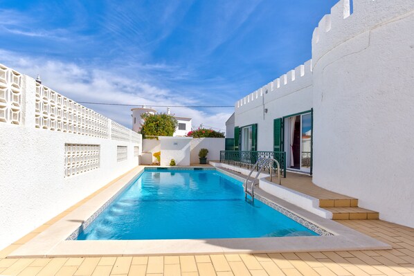 Private swimming pool with sun terrace.