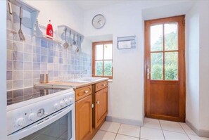 kitchen with back door leading to an enclosed private garden