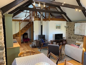 Open plan kitchen, dining room, living room view towards the mezzanine