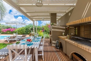 Dining area next to the BBQ and pool!