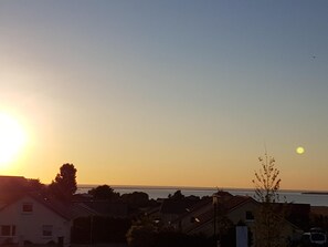 Sonnenuntergang von dem Balkon aus.