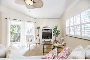 Cozy couch in the living room. Enjoy a glass of wine or watch some TV.