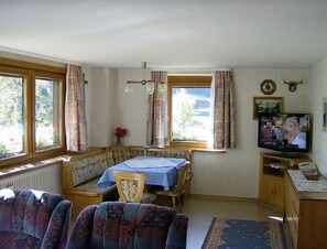 The living room offers a great view to nature.