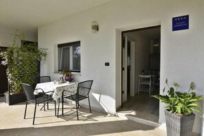 The terrace furnished with table and chairs where you can have coffee in the morning while admiring the little game and