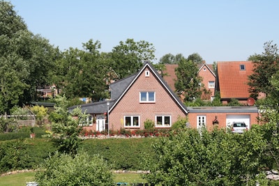 near the dyke (30m) and green beach, sea water swimming pool