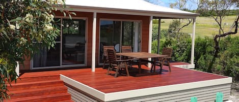 Outdoor deck area with outdoor setting with views into Innes National Park