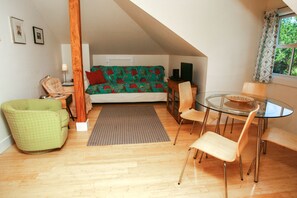 Wonderful living area with full size couch--not apartment size! Lots of sunlight