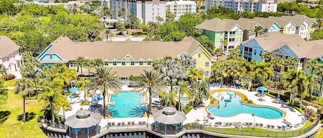 2 Pools, Clubhouse & Colorful Villas Surround Lagoon. 3 more pools across street