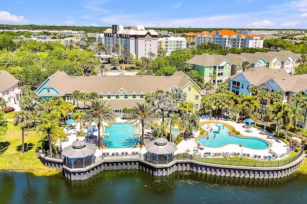 2 Pools, Clubhouse & Colorful Villas Surround Lagoon. 3 more pools across street