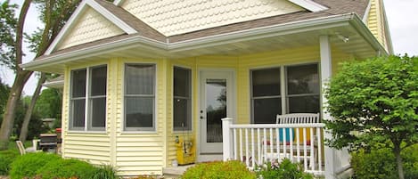 Sunset Nook Cottage is nestled nicely on a beautiful, level lot leading to the water.