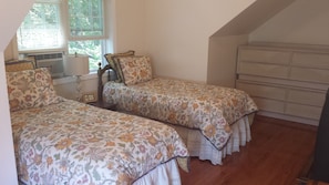 the 4th bedroom is spacious and bright w/ 2 twin beds, air conditioning  and TV.