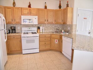 Fully equipped kitchen with granite countertops