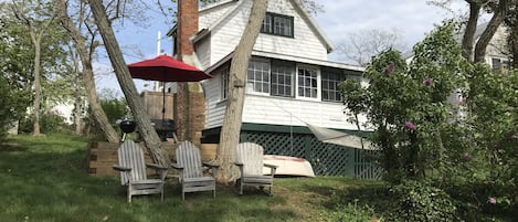 Front of Castleway, side yard & picnic table. Trees holding hammock now gone.


