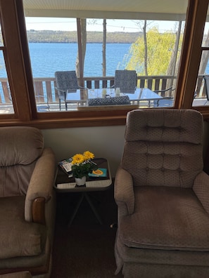 Living room looking out over porch to lake
