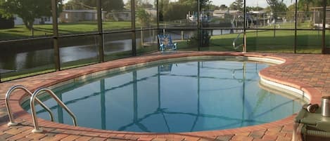 Pool and deck looking over canal, faces west  you have sun all day at pool.