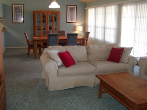 Inside, living and dining room have windows with breathtaking views