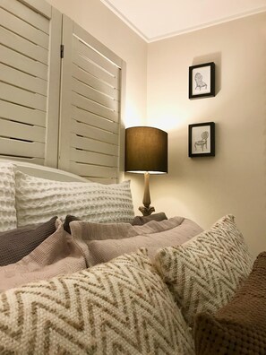 Double bed in its own bedroom, with a large built in wardrobe. 