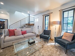 Living room with lots of seating and natural light