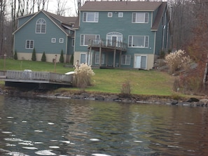 View of house from boat on lake