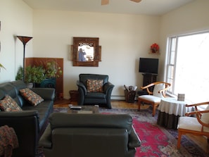 Living room with large window with lake view