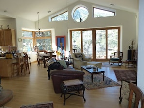 Vaulted ceiling great room with amazing private views, ceiling fan, media wall.
