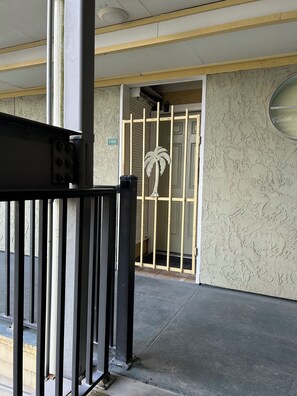 Up one flight of stairs or use the elevator around the corner.  1 neighbor.