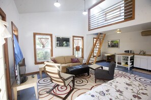 The downstairs of the Studio is open and roomy. Stairs lead to the loft and bath
