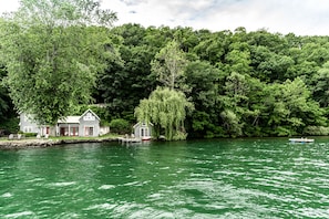 O'Cottage! 150 feet of level lake frontage. Located on a private, one-lane road.