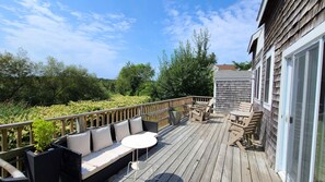 Deck with outdoor furniture and gas grill