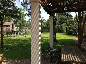 Your drive up brings you to our lovely arbor and one-acre yard with playground.
