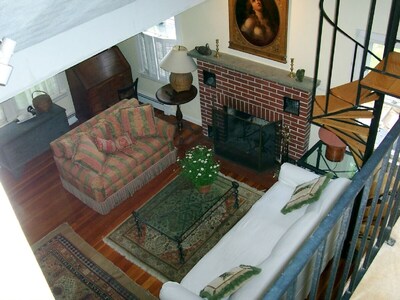 View down from bedroom loft into livingroom