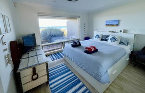 Main/King Bedroom - sea view. Walk in wardrobe thru to bathroom. Ducted air con