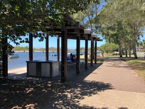 Beautiful shady BBQ and picnic areas along the rivers edge